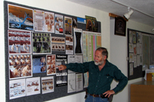 Jim Halfpenny at bear bulletin board in classroom